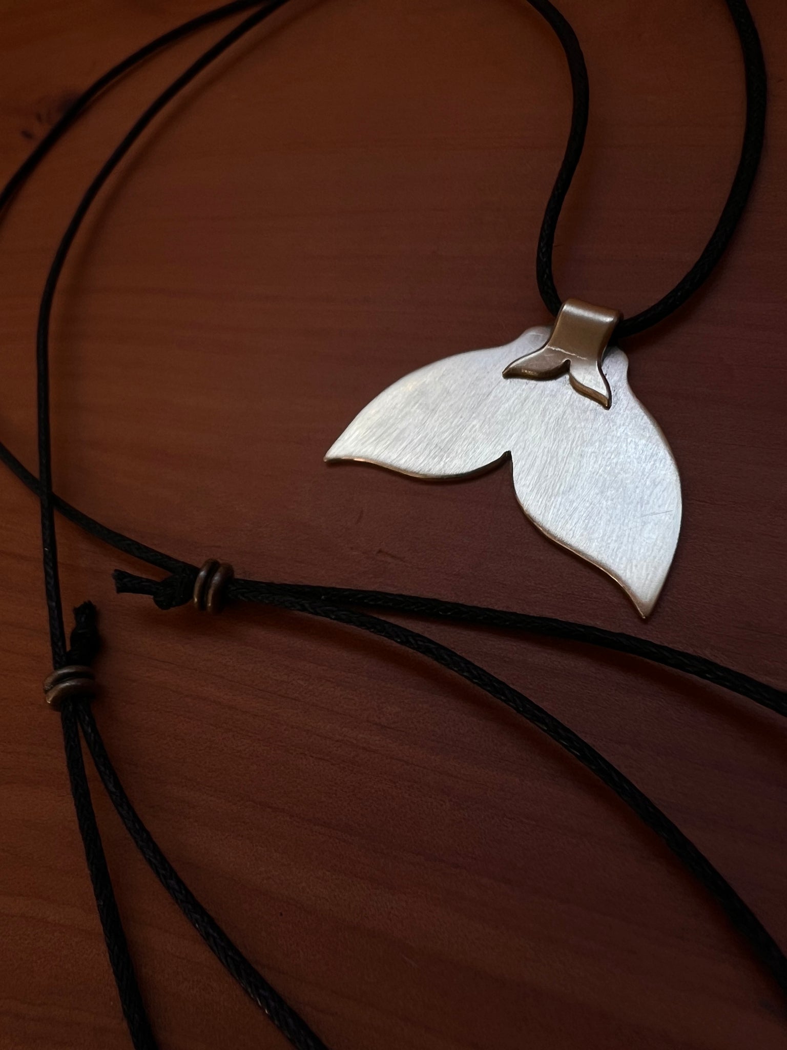The golden whale tail pendants