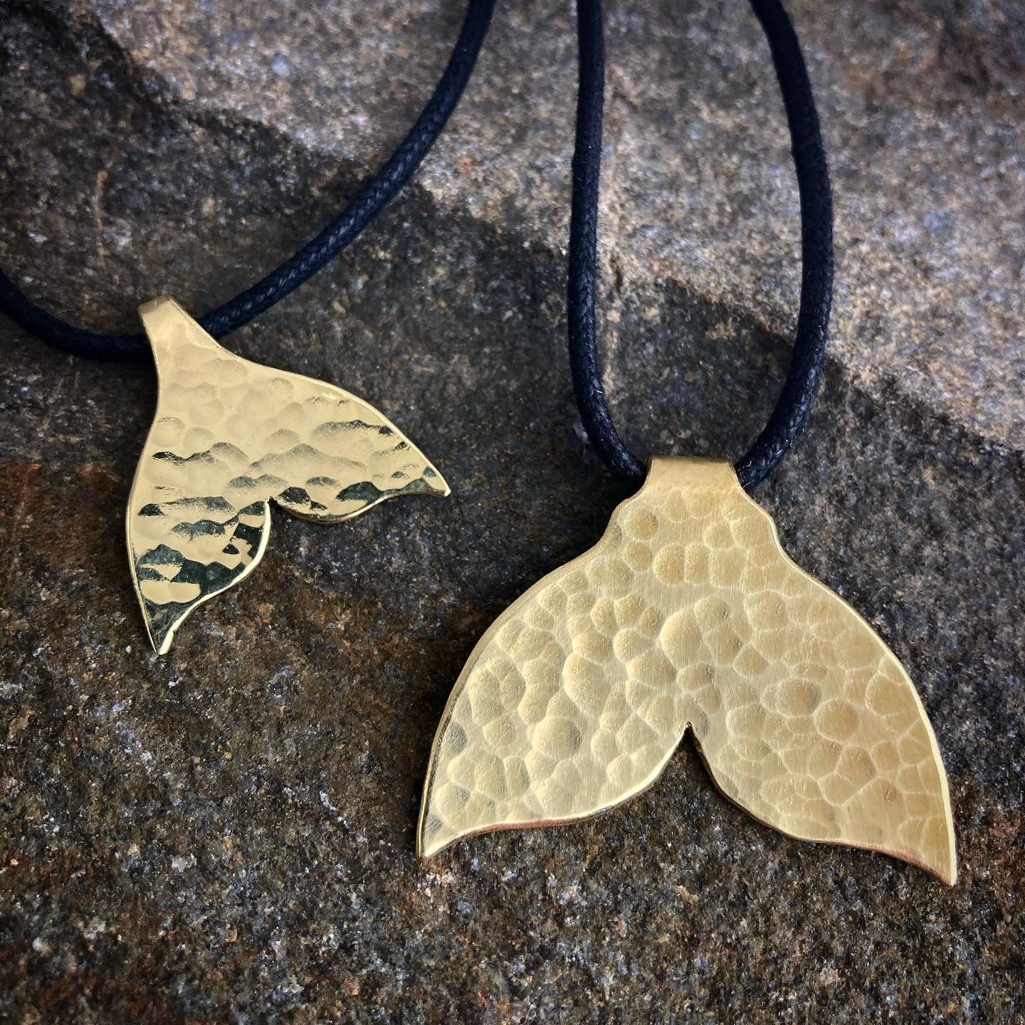 The golden whale tail pendants