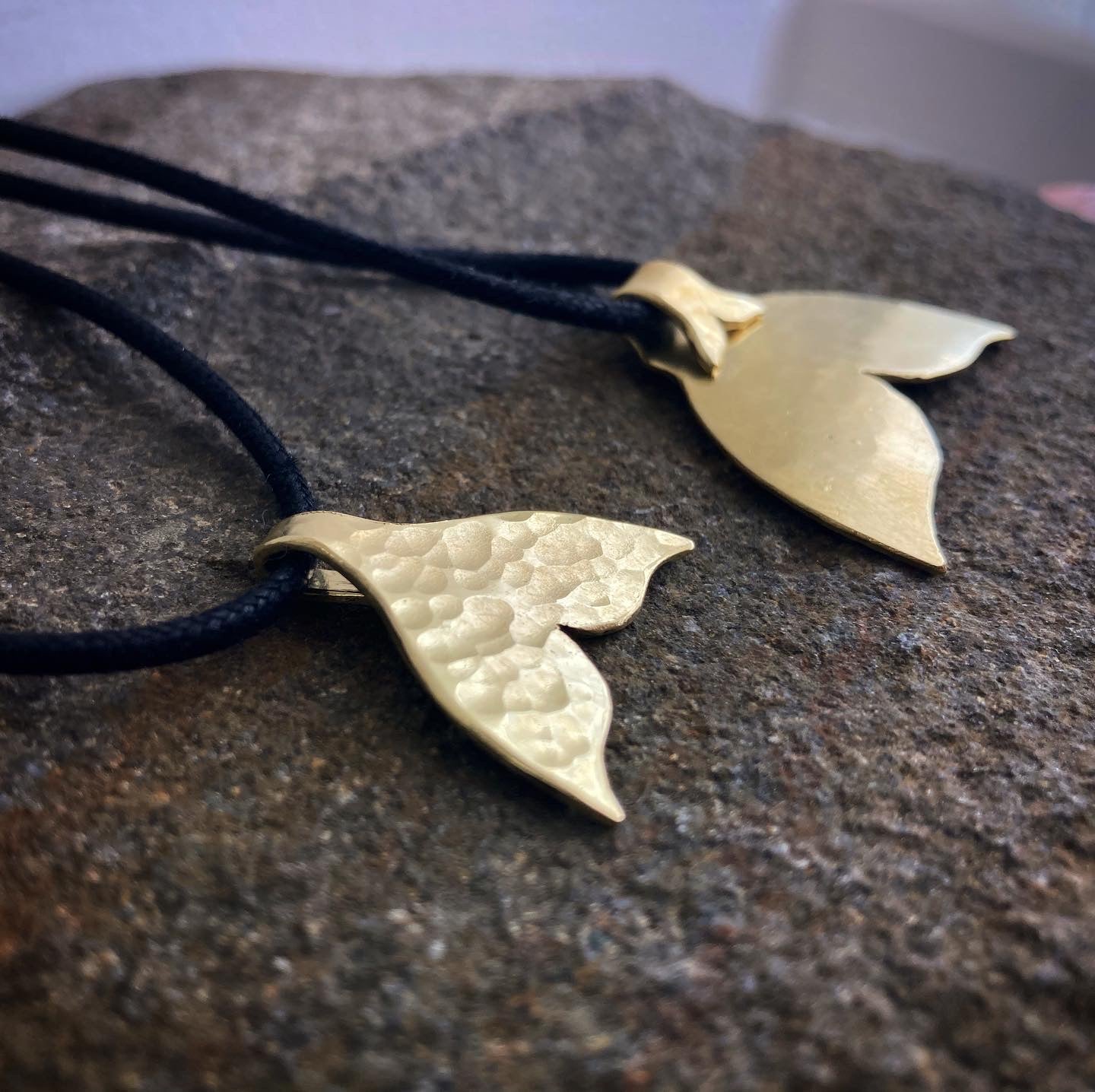 The golden whale tail pendants