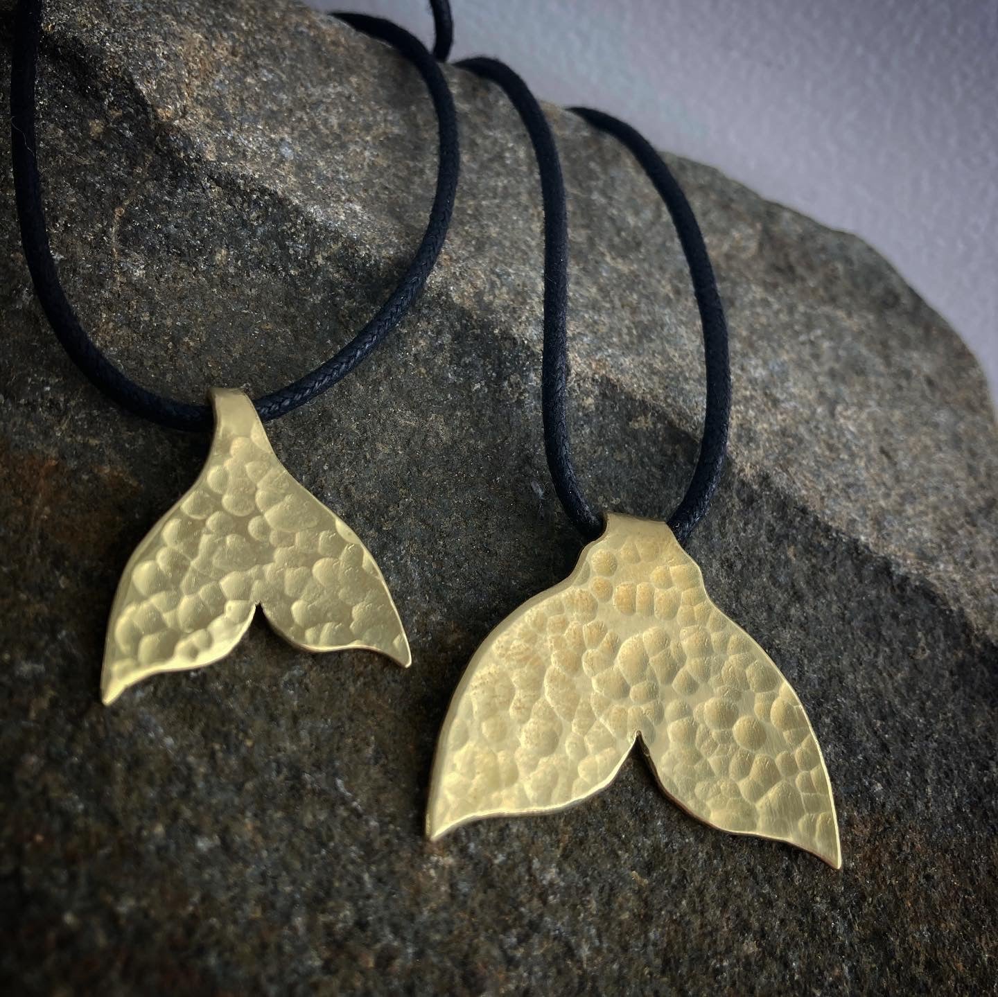 The golden whale tail pendants