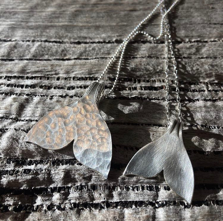 whale tail pendant on silver chain hammered texture and brushed finish on petite pendant